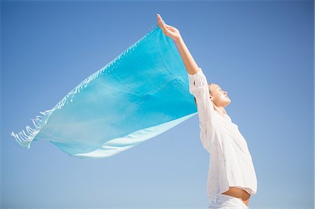 simsearch:6109-07496983,k - Blonde woman relaxing on the beach Stock Photo - Premium Royalty-Free, Code: 6109-08536751