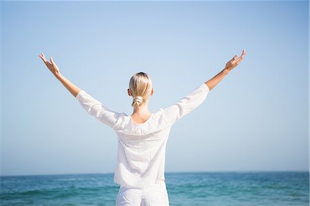 simsearch:6109-07496983,k - Blonde woman relaxing on the beach Stock Photo - Premium Royalty-Free, Code: 6109-08536733