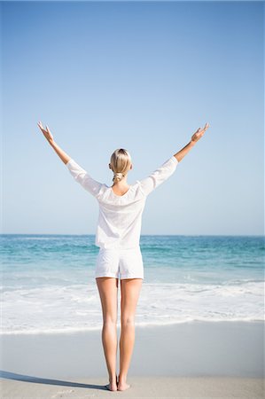 simsearch:6109-07496983,k - Blonde woman relaxing on the beach Stock Photo - Premium Royalty-Free, Code: 6109-08536734