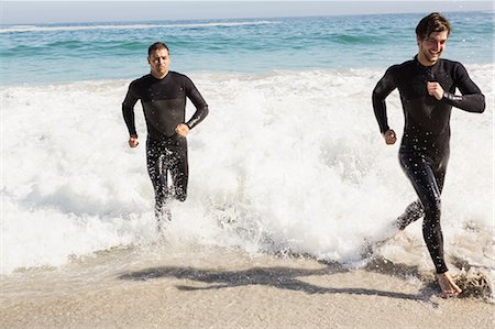 simsearch:649-08237639,k - Handsome men running in wetsuits Stock Photo - Premium Royalty-Free, Code: 6109-08536890