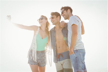 Happy friends taking a selfie Stock Photo - Premium Royalty-Free, Code: 6109-08536827