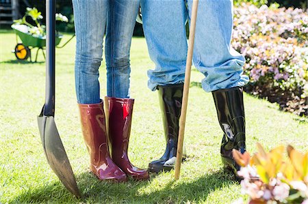 Couple in wellington boots in their garden Stock Photo - Premium Royalty-Free, Code: 6109-08536998