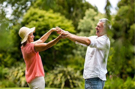 simsearch:673-03623209,k - Senior couple enjoying while dancing in yard Stock Photo - Premium Royalty-Free, Code: 6109-08537038