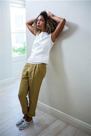 simsearch:6109-08537404,k - Tensed woman leaning on wall Stock Photo - Premium Royalty-Free, Code: 6109-08537147