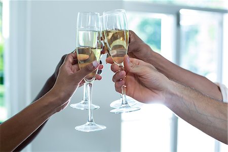 simsearch:6109-08804832,k - Hands toasting wine glasses Stock Photo - Premium Royalty-Free, Code: 6109-08537108