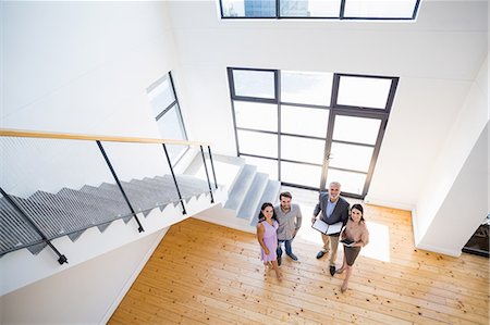 Real estate agent showing new house to couple Photographie de stock - Premium Libres de Droits, Code: 6109-08537136