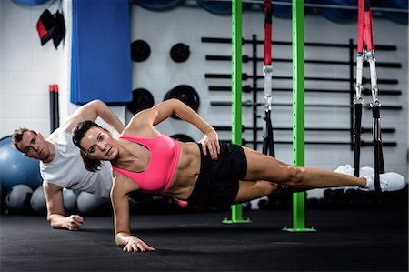 simsearch:6109-08537491,k - Man and woman doing suspension training with trx fitness straps Photographie de stock - Premium Libres de Droits, Code: 6109-08537485