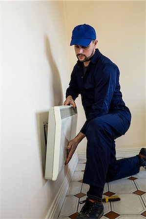 Handyman testing air conditioner Photographie de stock - Premium Libres de Droits, Code: 6109-08537512