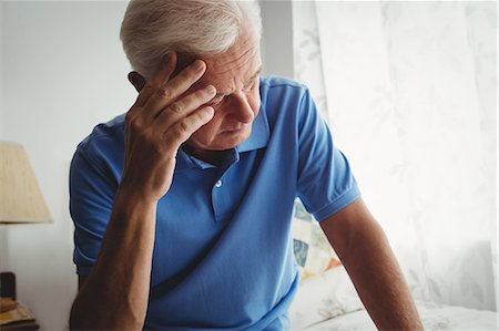 simsearch:6109-08538390,k - Thoughtful senior man sitting on his bed Stock Photo - Premium Royalty-Free, Code: 6109-08538273