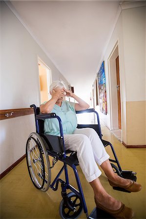 person in wheelchair at home - Senior woman sitting in a wheelchair Stock Photo - Premium Royalty-Free, Code: 6109-08538299