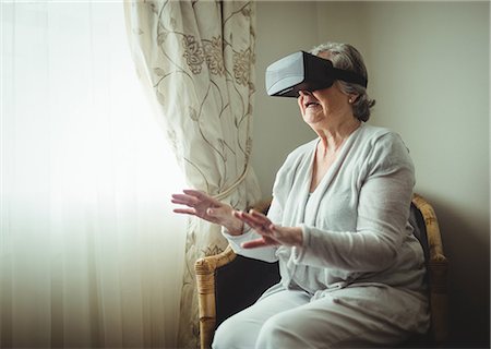 senior woman home computer - Senior woman using an oculus rift Stock Photo - Premium Royalty-Free, Code: 6109-08538220