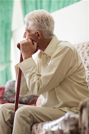 patient (homme malade) - Thoughtful senior man sitting with a cane Stock Photo - Premium Royalty-Free, Code: 6109-08538389