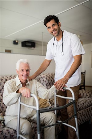 simsearch:6109-08689542,k - Nurse helping senior man to stand up Stock Photo - Premium Royalty-Free, Code: 6109-08538395