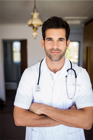 simsearch:6109-08538435,k - Smiling nurse with arms crossed Stock Photo - Premium Royalty-Free, Code: 6109-08538323