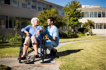 simsearch:6109-08538447,k - Nurse pushing the senior womans wheelchair Stock Photo - Premium Royalty-Free, Code: 6109-08538446