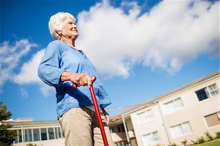 senior nursing home - A senior woman walking with her walking stick Stock Photo - Premium Royalty-Free, Code: 6109-08538457