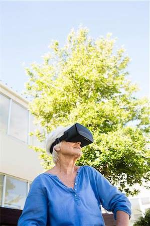 sick person being nursed at home - Senior woman looking in 3D glasses Stock Photo - Premium Royalty-Free, Code: 6109-08538469