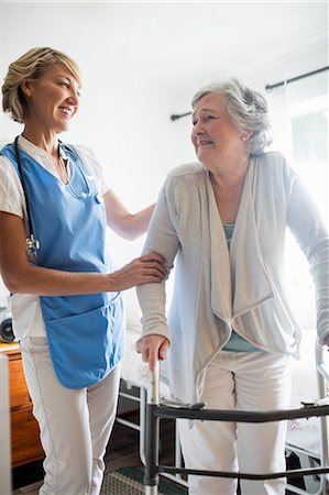 simsearch:6109-08538408,k - Nurse helping senior woman to stand up Stock Photo - Premium Royalty-Free, Code: 6109-08538475