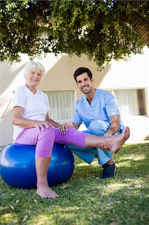simsearch:6109-08538408,k - Nurse helping senior woman doing exercises Stock Photo - Premium Royalty-Free, Code: 6109-08538410