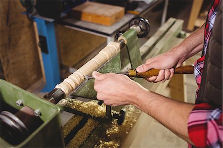 people in the wood shop - Carpenter sculpting a wood piece in carpentry Stock Photo - Premium Royalty-Free, Code: 6109-08689607