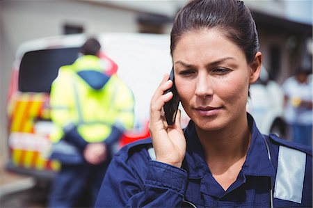 simsearch:6109-08689784,k - Portrait of a serious ambulance women making a phone call Photographie de stock - Premium Libres de Droits, Code: 6109-08689770