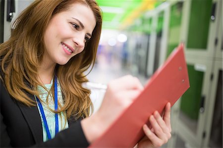 simsearch:6109-08690053,k - Technician preparing check list in server room Stock Photo - Premium Royalty-Free, Code: 6109-08690083