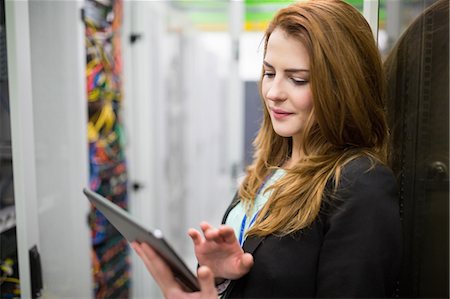 simsearch:632-07809292,k - Technician using digital tablet in server room Stock Photo - Premium Royalty-Free, Code: 6109-08690086