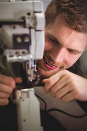 simsearch:700-02958016,k - Cobbler using sewing machine in workshop Stock Photo - Premium Royalty-Free, Code: 6109-08690035