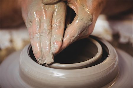 simsearch:649-07736605,k - Cropped hands of craftsperson molding shape in pottery workshop Photographie de stock - Premium Libres de Droits, Code: 6109-08690233