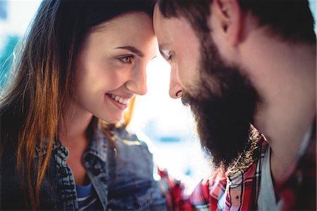 simsearch:6109-08690396,k - Happy young couple looking at each other in cafe Stock Photo - Premium Royalty-Free, Code: 6109-08690379