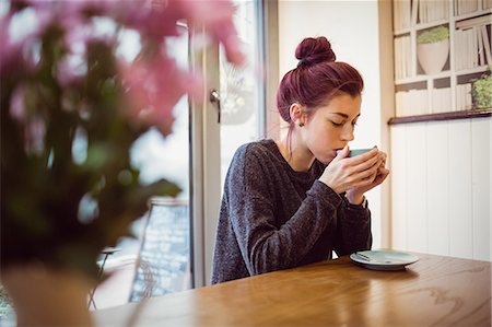 Hipster drinking a cup of coffee in cafe Stock Photo - Premium Royalty-Free, Code: 6109-08690439