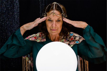 senior ball - Mature fortune teller with crystal ball Stock Photo - Premium Royalty-Free, Code: 6109-08690513