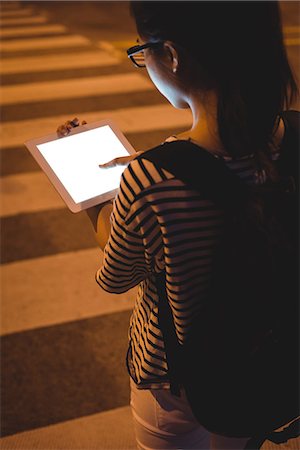 simsearch:614-06442503,k - Rear view of young woman using digital tablet on street at night Stockbilder - Premium RF Lizenzfrei, Bildnummer: 6109-08764135