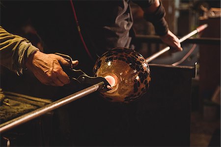 simsearch:614-06973581,k - Glassblower holding a blowpipe with diamond shears at glassblowing factory Stock Photo - Premium Royalty-Free, Code: 6109-08764203