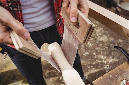 simsearch:6109-08764368,k - Mid section of man working on wooden plank in boatyard Stockbilder - Premium RF Lizenzfrei, Bildnummer: 6109-08764360