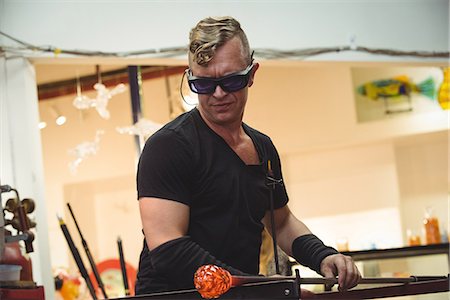 simsearch:614-06973581,k - Glassblower shaping a molten glass at glassblowing factory Stock Photo - Premium Royalty-Free, Code: 6109-08764854