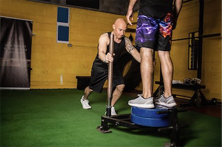 simsearch:6109-08765077,k - Thai boxers practicing weight exercise in the fitness studio Photographie de stock - Premium Libres de Droits, Code: 6109-08765040