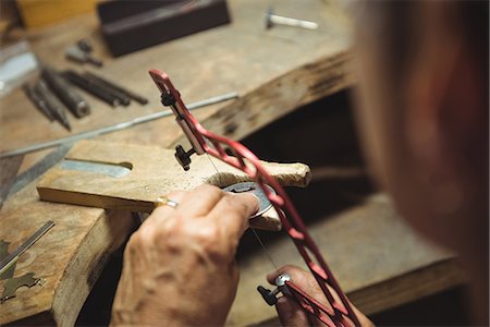 simsearch:693-05794405,k - Close-up of craftswoman working in workshop Stock Photo - Premium Royalty-Free, Code: 6109-08765210