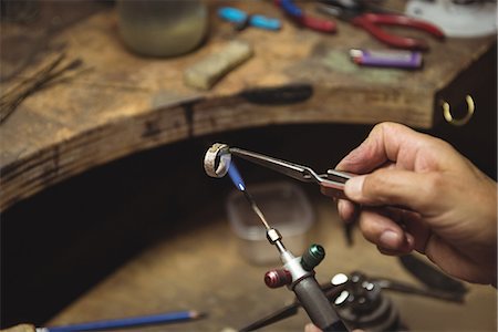 simsearch:6115-06967231,k - Hands of craftswoman using blow torch in workshop Stock Photo - Premium Royalty-Free, Code: 6109-08765214