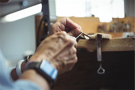 simsearch:6115-06967231,k - Close-up of craftswoman working in workshop Stock Photo - Premium Royalty-Free, Code: 6109-08765222