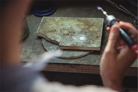 simsearch:6102-05802622,k - Close-up of craftswoman using blow torch in workshop Stockbilder - Premium RF Lizenzfrei, Bildnummer: 6109-08765224