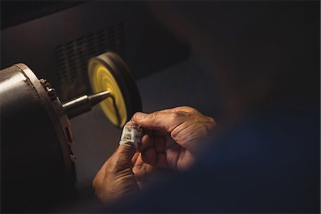 simsearch:6115-06967231,k - Hands of craftswoman working on a machine in workshop Stock Photo - Premium Royalty-Free, Code: 6109-08765231