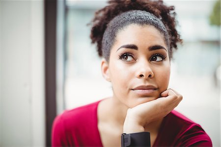 simsearch:6109-08690493,k - Close-up of thoughtful young woman with hand on chin at restaurant Stockbilder - Premium RF Lizenzfrei, Bildnummer: 6109-08700245