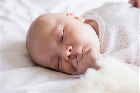 simsearch:6109-07497306,k - Cute baby sleeping on a bed with teddy bear at home Stock Photo - Premium Royalty-Free, Code: 6109-08700779