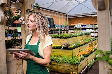 simsearch:6109-08701231,k - Female florist holding digital tablet at garden centre Stock Photo - Premium Royalty-Free, Code: 6109-08701207