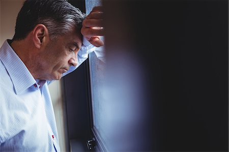 simsearch:400-07334526,k - Close-up of doctor standing near window in the hospital Stock Photo - Premium Royalty-Free, Code: 6109-08701362