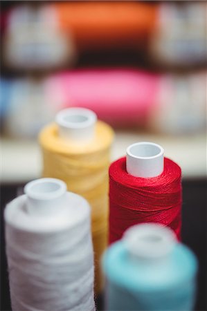 simsearch:6109-08701559,k - Close-up of colorful spools of thread in the studio Stock Photo - Premium Royalty-Free, Code: 6109-08701543