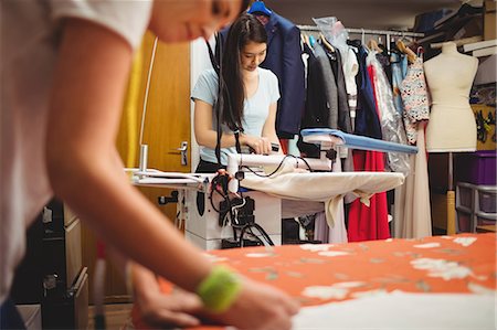 simsearch:6109-08764888,k - Two female fashion designers working in the studio Stock Photo - Premium Royalty-Free, Code: 6109-08701521