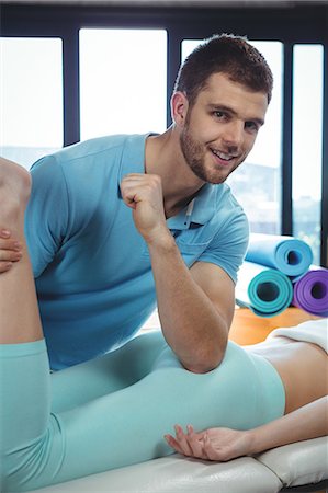 simsearch:6109-08701718,k - Male physiotherapist giving hip massage to female patient in clinic Stock Photo - Premium Royalty-Free, Code: 6109-08701668