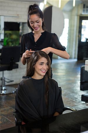 salon - Smiling female getting her hair trimmed at a salon Stock Photo - Premium Royalty-Free, Code: 6109-08705225